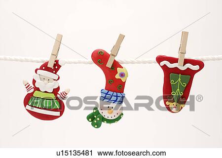 Christmas objects hanging on line View Large Photo Image Stock Image - Christmas objects hanging on line. Fotosearch