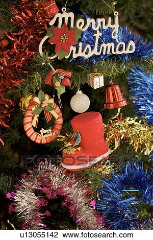 Stock Image - Christmas tree with Christmas ornament. Fotosearch