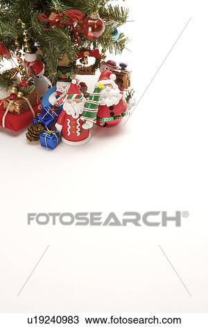 Stock Image - Christmas tree with snowmen and Santa Claus. Fotosearch