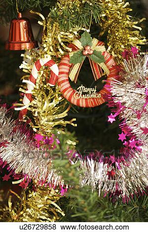Christmas tree with wreath and bell View Large Photo Image Stock Photo - Christmas tree with wreath and bell. Fotosearch