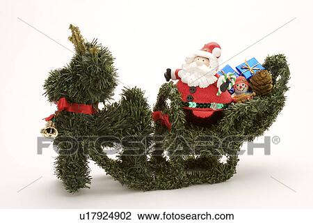 Stock Image - Plastic Santa Claus and Reindeer. Fotosearch