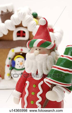 Stock Photo - Santa Claus and Gingerbread House. Fotosearch