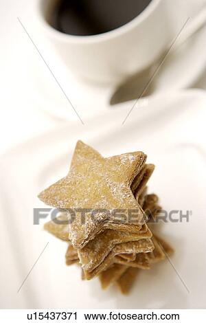 Stock Image - Star shaped cookies and a cup of coffee. Fotosearch