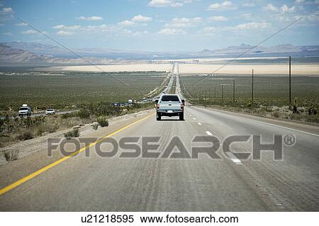 Stock Photography - American West, Car on road. Fotosearch