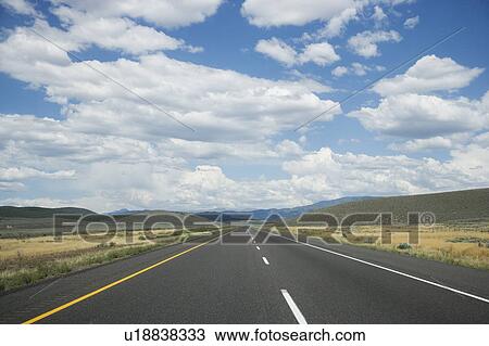 Stock Image - American West, Empty road. Fotosearch