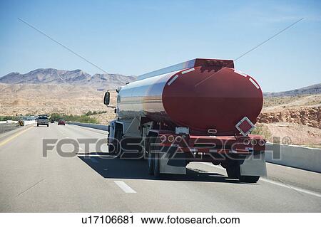 American West, Fuel tanker and cars on road View Large Photo Image Stock Image - American West, Fuel tanker and cars on road. Fotosearch