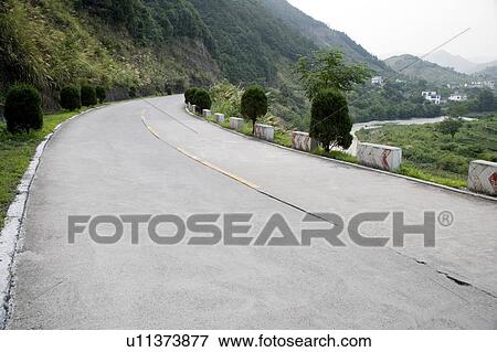 Stock Photo - China, Jiuzhaigou, country road. Fotosearch