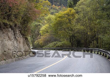 Stock Photo - China, Jiuzhaigou, Road on cliff. Fotosearch