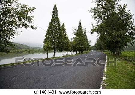 Stock Image - China, Mt. Huangshan, Road in non-urban setting. Fotosearch