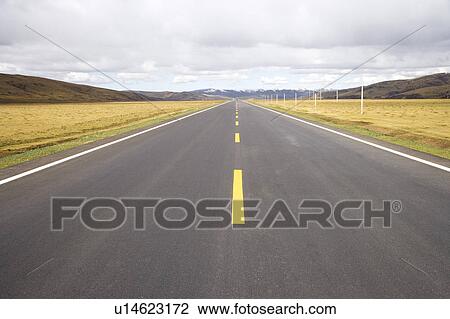 Stock Image - China, Ruoergai Grassland, Empty road. Fotosearch