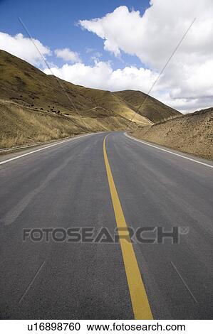 Stock Image - China, Ruoergai Grassland, Empty road. Fotosearch