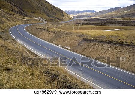 Stock Photo - China, Ruoergai Grassland, Empty road. Fotosearch