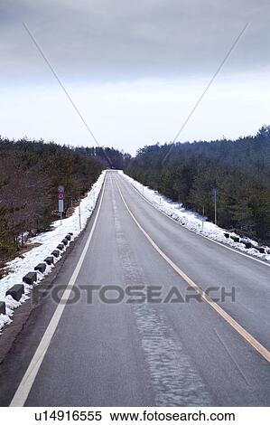 Stock Photography - Japan, Empty road with snow. Fotosearch