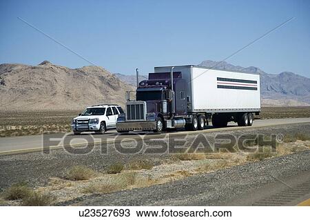 Stock Image - USA, Car and truck on road. Fotosearch