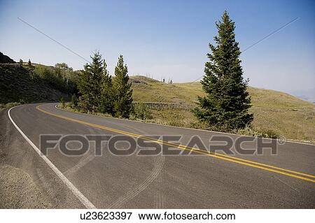 Stock Photo - USA, Yellowstone National Park, Empty road. Fotosearch