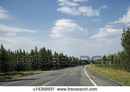 Stock Photo - USA, Yellowstone National Park, Road in non-urban setting. Fotosearch