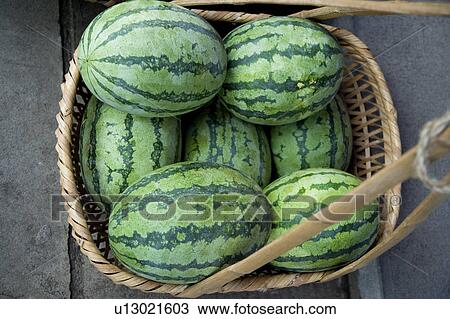 Stock Image - Basket with watermelons. Fotosearch