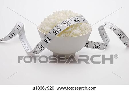 A bowl of rice and Tape Measure, 123 View Large Photo Image Stock Image - A bowl of rice and Tape Measure, 123. Fotosearch