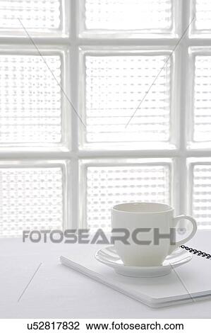 Coffee cup on notebook View Large Photo Image Stock Image - Coffee cup on notebook. Fotosearch