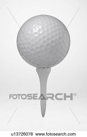 Stock Photo - Golf ball on tee. Fotosearch