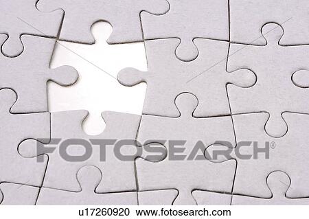 Stock Image - Missing piece of jigsaw puzzle. Fotosearch