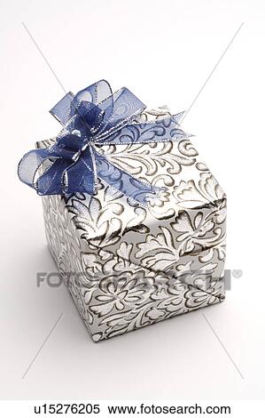 Stock Photography - Close-up of a wrapped gift with bowknot. Fotosearch