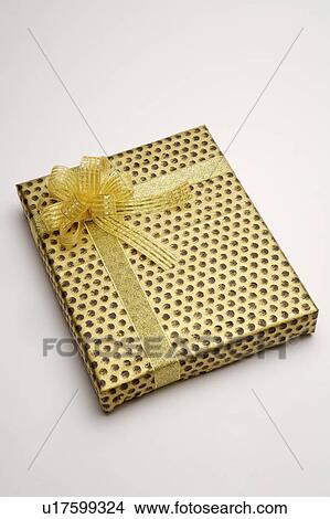 Picture - Close-up of a wrapped gift with beautiful packaging. Fotosearch