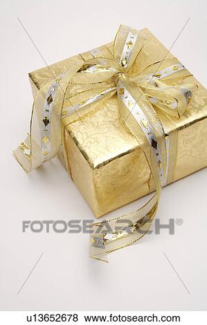 Close-up of a wrapped gift with beautiful packaging View Large Photo Image Stock Photo - Close-up of a wrapped gift with beautiful packaging. Fotosearch