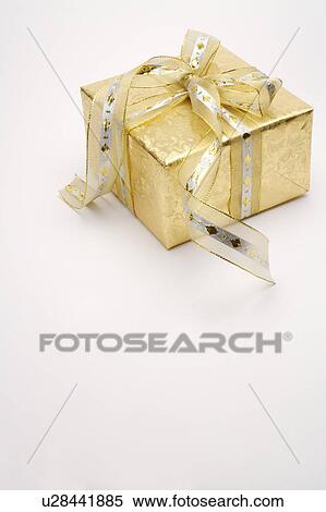 Close-up of a wrapped gift with beautiful packaging View Large Photo Image Stock Photography - Close-up of a wrapped gift with beautiful packaging. Fotosearch