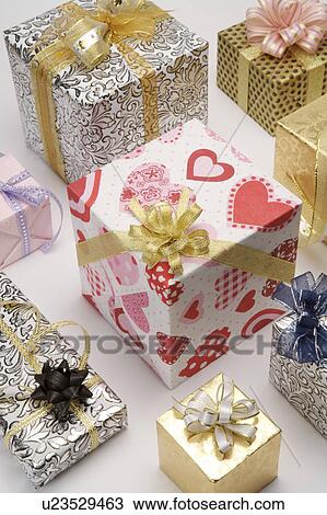 Stock Image - Close-up of wrapped gifts with beautiful packaging. Fotosearch