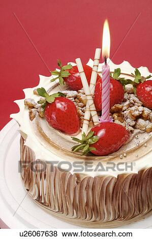 Close-up of a birthday cake with strawberries and candle on it View Large Photo Image Stock Photo - Close-up of a birthday cake with strawberries and candle on it. Fotosearch