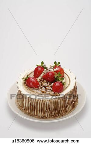 Stock Photograph - Close-up of a birthday cake with strawberries. Fotosearch