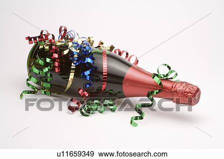 Stock Photo - Close-up of a bottle with paper decoration. Fotosearch