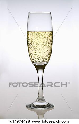 Close-up of a glass of champagne View Large Photo Image Stock Photo - Close-up of a glass of champagne. Fotosearch