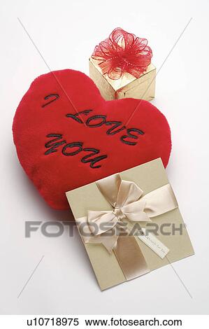 "Close-up of a present, a card and a red cushion with letters" View Large Photo Image Stock Photography - "Close-up of a present, a card and a red cushion with letters". Fotosearch