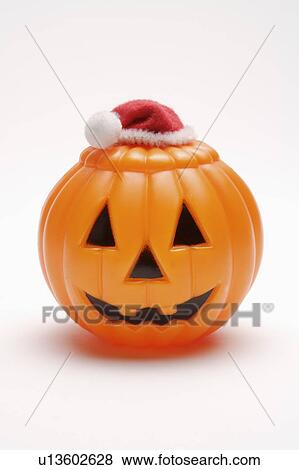 Close-up of a pumpkin with a Santa hat View Large Photo Image Stock Photo - Close-up of a pumpkin with a Santa hat. Fotosearch