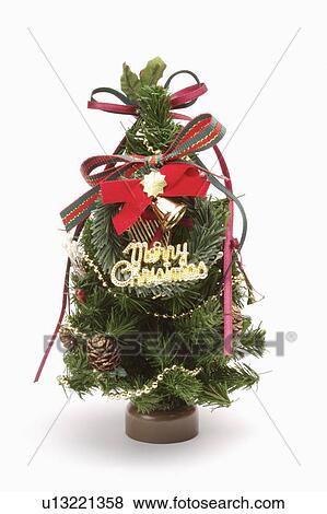 Close-up of a small Christmas tree with decoration View Large Photo Image Stock Photo - Close-up of a small Christmas tree with decoration. Fotosearch