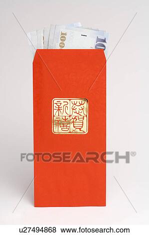 Stock Photo - Close-up of paper money in a red envelope. Fotosearch