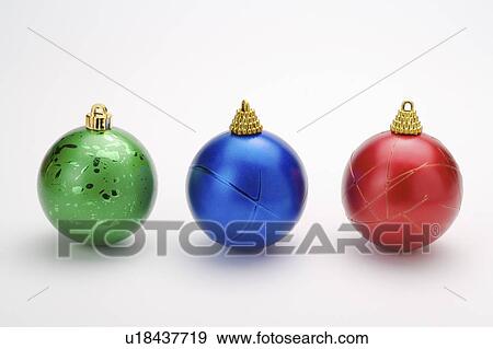 Close-up of three Christmas bauble with different colors View Large Photo Image Stock Photo - Close-up of three Christmas bauble with different colors. Fotosearch