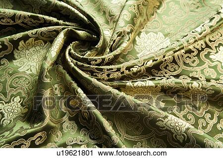 Stock Image - Close-up of wrinkled textile with lucky pattern. Fotosearch