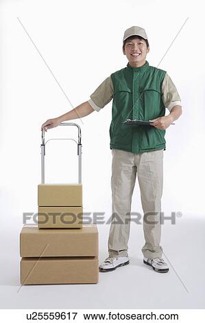 Delivery-person with box and clipboard View Large Photo Image Stock Photo - Delivery-person with box and clipboard. Fotosearch