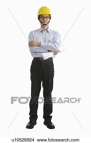 Engineer standing with hands on chest and holding blueprint View Large Photo Image Picture - Engineer standing with hands on chest and holding blueprint. Fotosearch