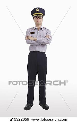 Stock Photo - Police officer standing with hands on chest. Fotosearch