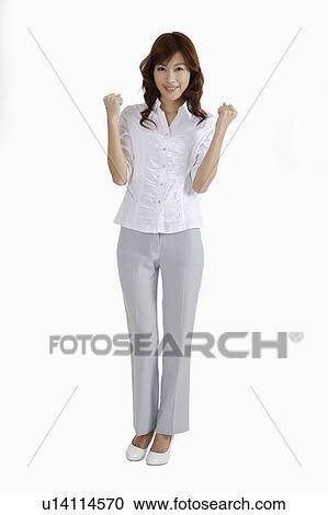Young female journalist standing with fists up View Large Photo Image Stock Image - Young female journalist standing with fists up. Fotosearch