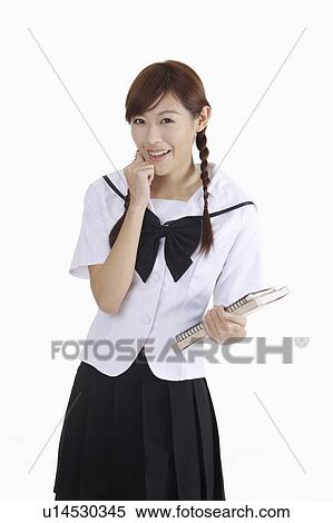 Young female student holding books View Large Photo Image Stock Photography - Young female student holding books. Fotosearch