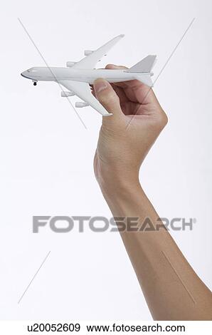 Stock Photo - Model airplane held in hand. Fotosearch