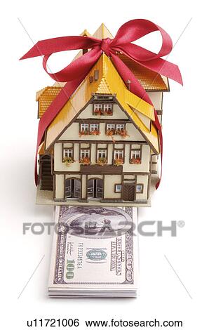 Money and a toy house View Large Photo Image Stock Photograph - Money and a toy house. Fotosearch