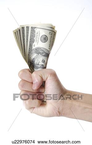 Money held tight in a hand View Large Photo Image Picture - Money held tight in a hand. Fotosearch