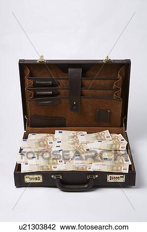 Stock Image - Paper money in a suitcase. Fotosearch