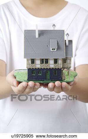 Toy Villa held by someone View Large Photo Image Stock Photography - Toy Villa held by someone. Fotosearch